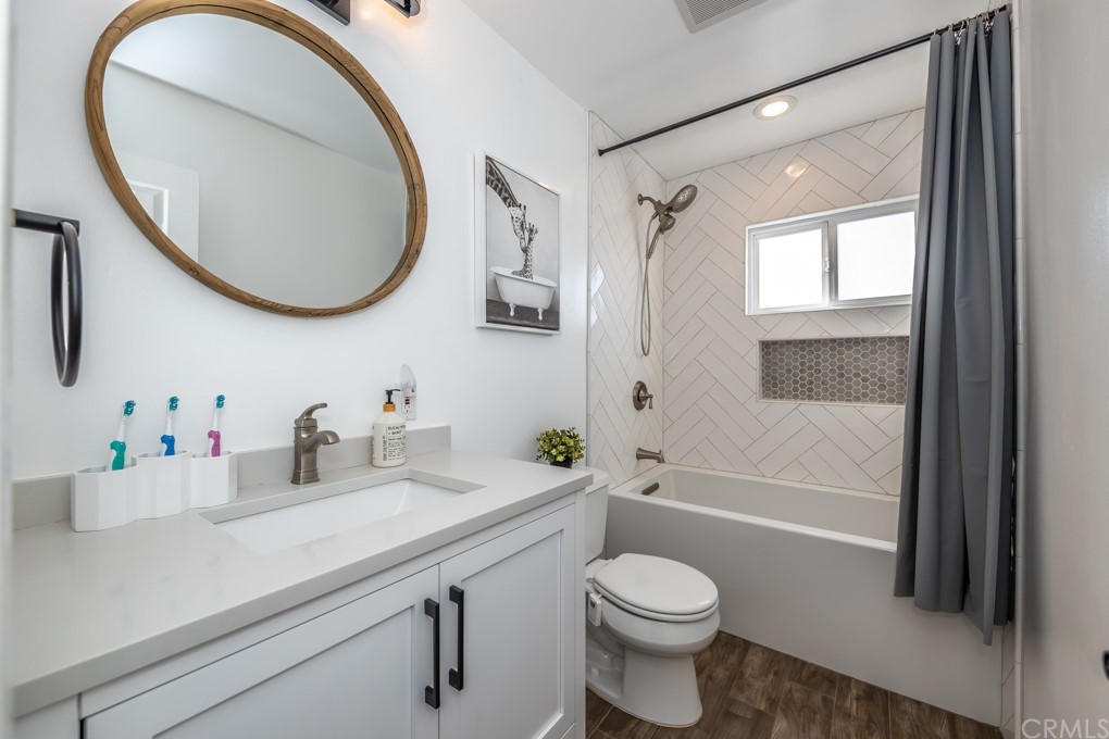 2114 Heloise Way Placentia, CA 92870 - Photo 42 of 61 a bathroom with a sink a toilet and a mirror