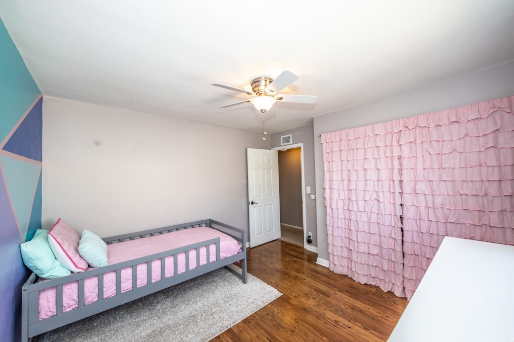 2114 Heloise Way Placentia, CA 92870 - Photo 45 of 61 a bedroom with a bed and a chandelier