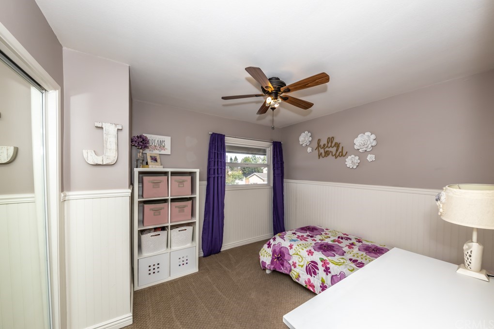 2114 Heloise Way Placentia, CA 92870 - Photo 46 of 61 a bedroom with a bed and a chandelier