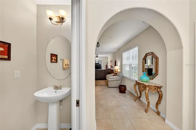 a view of a bathroom with a sink and mirror