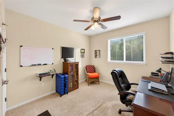 a work room with furniture and windows