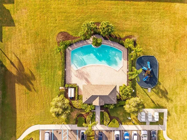 an aerial view of a residential building and lake view