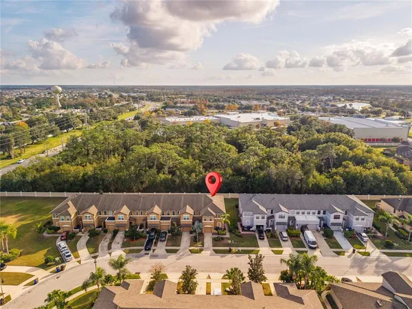 an aerial view of residential houses with outdoor space