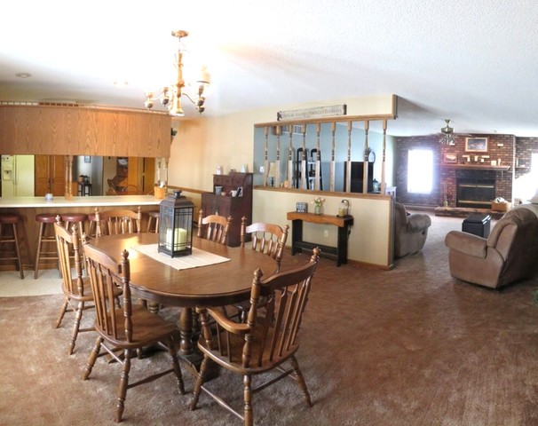 1202 Nelson Road Rock Falls, IL 61071 - Photo 13 of 31 a view of a dining room with furniture and chandelier