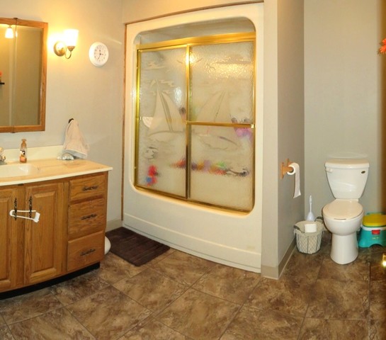 1202 Nelson Road Rock Falls, IL 61071 - Photo 23 of 31 a bathroom with a toilet sink and a mirror