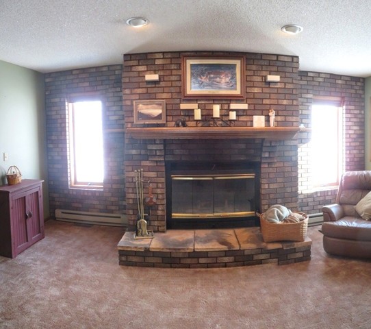 1202 Nelson Road Rock Falls, IL 61071 - Photo 6 of 31 a living room with furniture and a fireplace