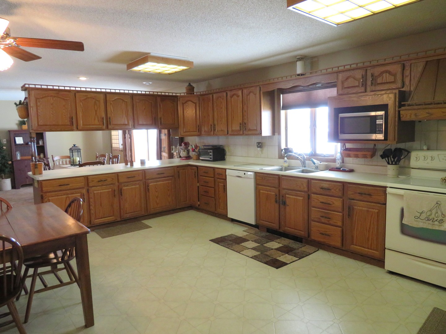 1202 Nelson Road Rock Falls, IL 61071 - Photo 8 of 31 a kitchen with a sink a window and cabinets