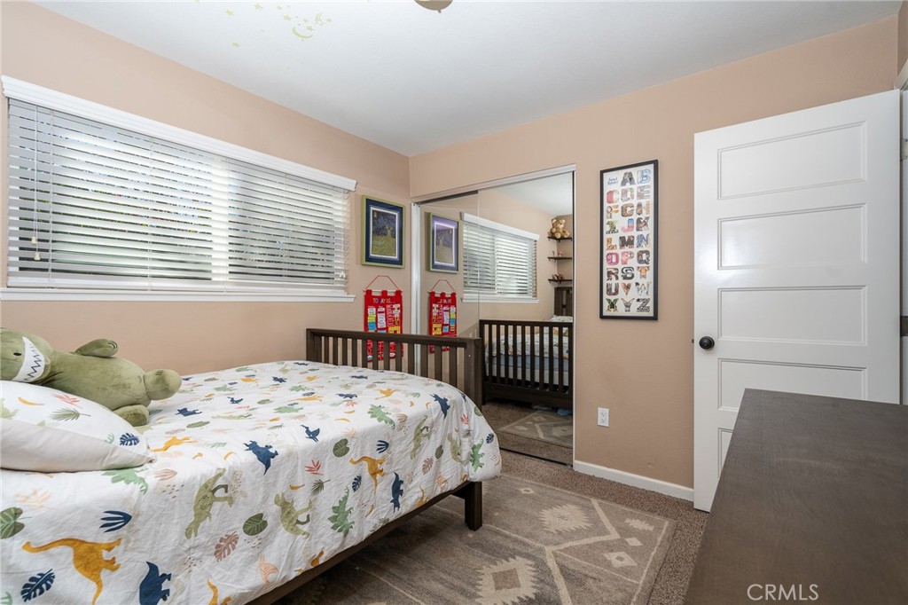 3165 Celeste Drive Riverside, CA 92507 - Photo 20 of 44 a bedroom with a bed and a window
