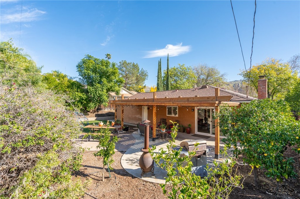 3165 Celeste Drive Riverside, CA 92507 - Photo 30 of 44 a view of a house with sitting area and garden