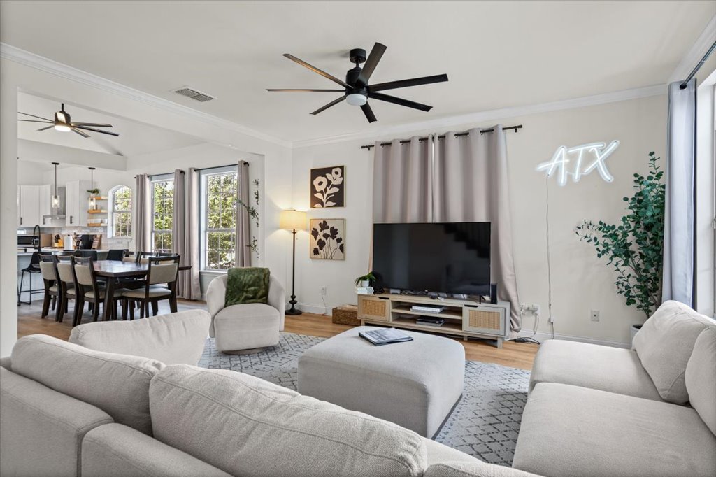 1201 Garden Street, Unit A Austin, TX 78702 - Photo 1 of 30 Spacious living area featuring wood-finish flooring, recessed lighting, and a modern ceiling fan