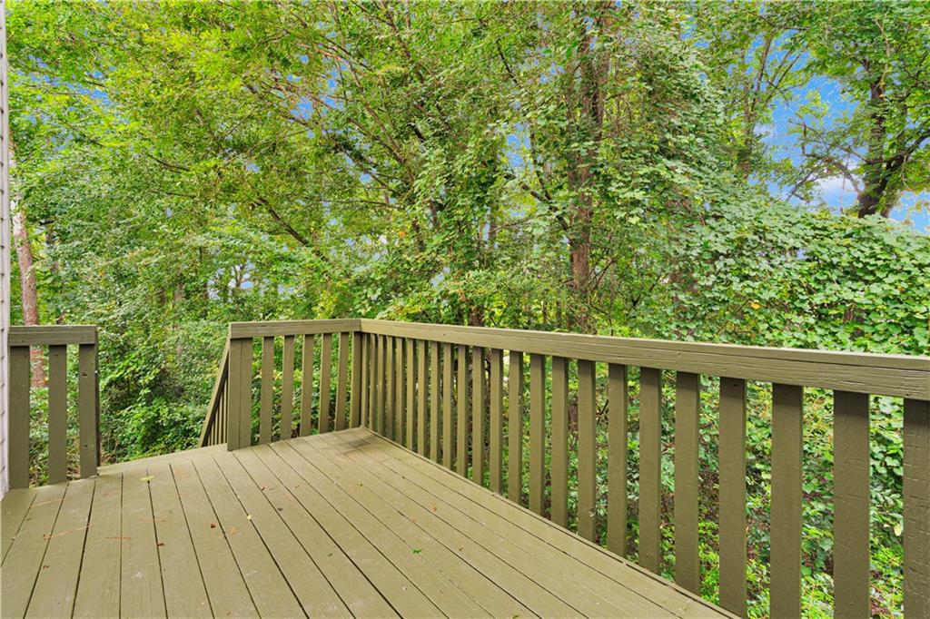 4005 Spring Cove Drive Duluth, GA 30097 - Photo 6 of 23 a balcony with wooden floor and fence