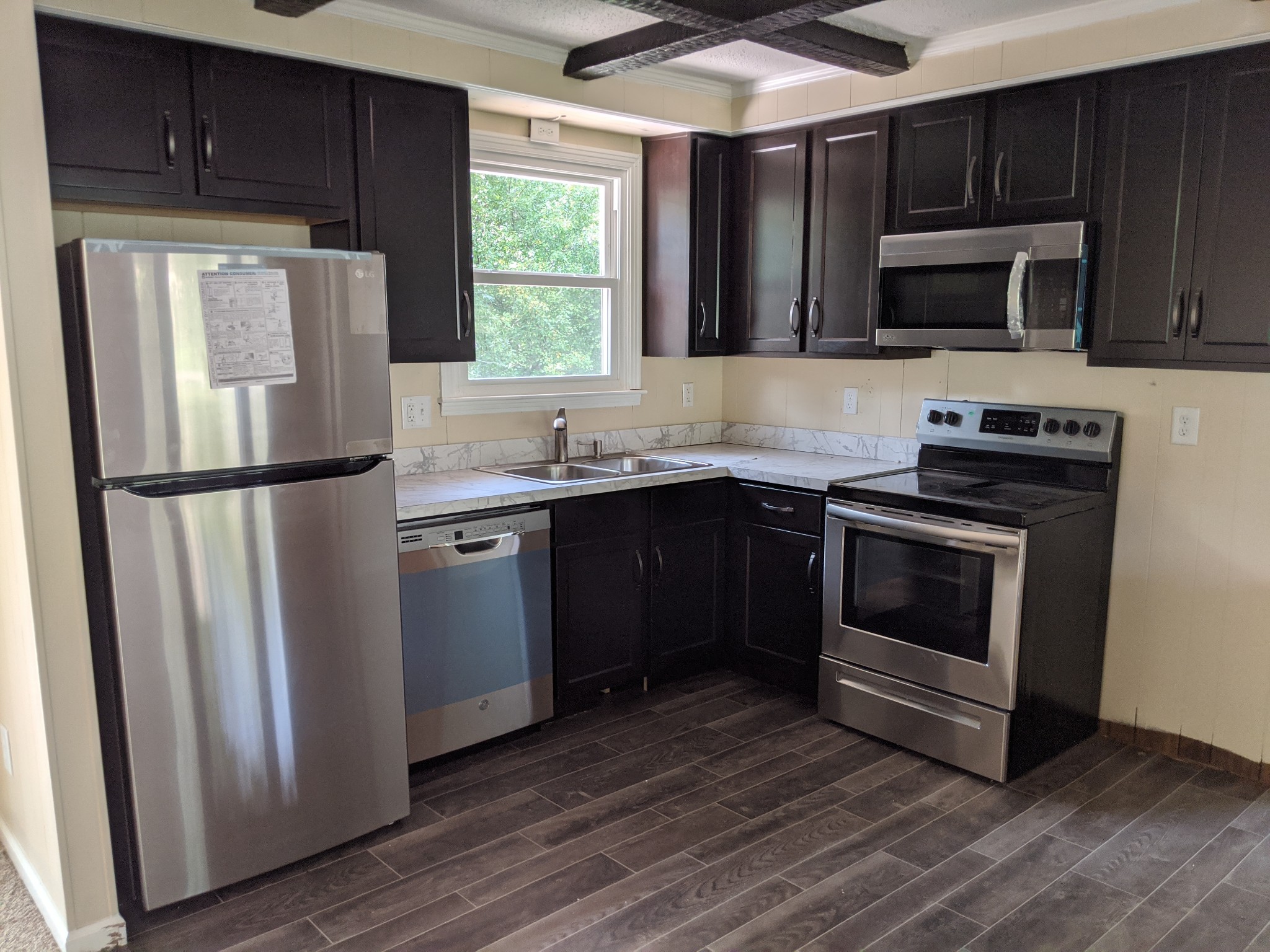 544 Bryan Road Clarksville, TN 37043 - Photo 6 of 14 a kitchen with stainless steel appliances granite countertop a stove a refrigerator and a microwave