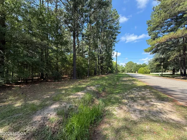 a view of road with trees