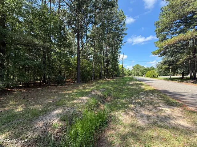 a view of road with trees