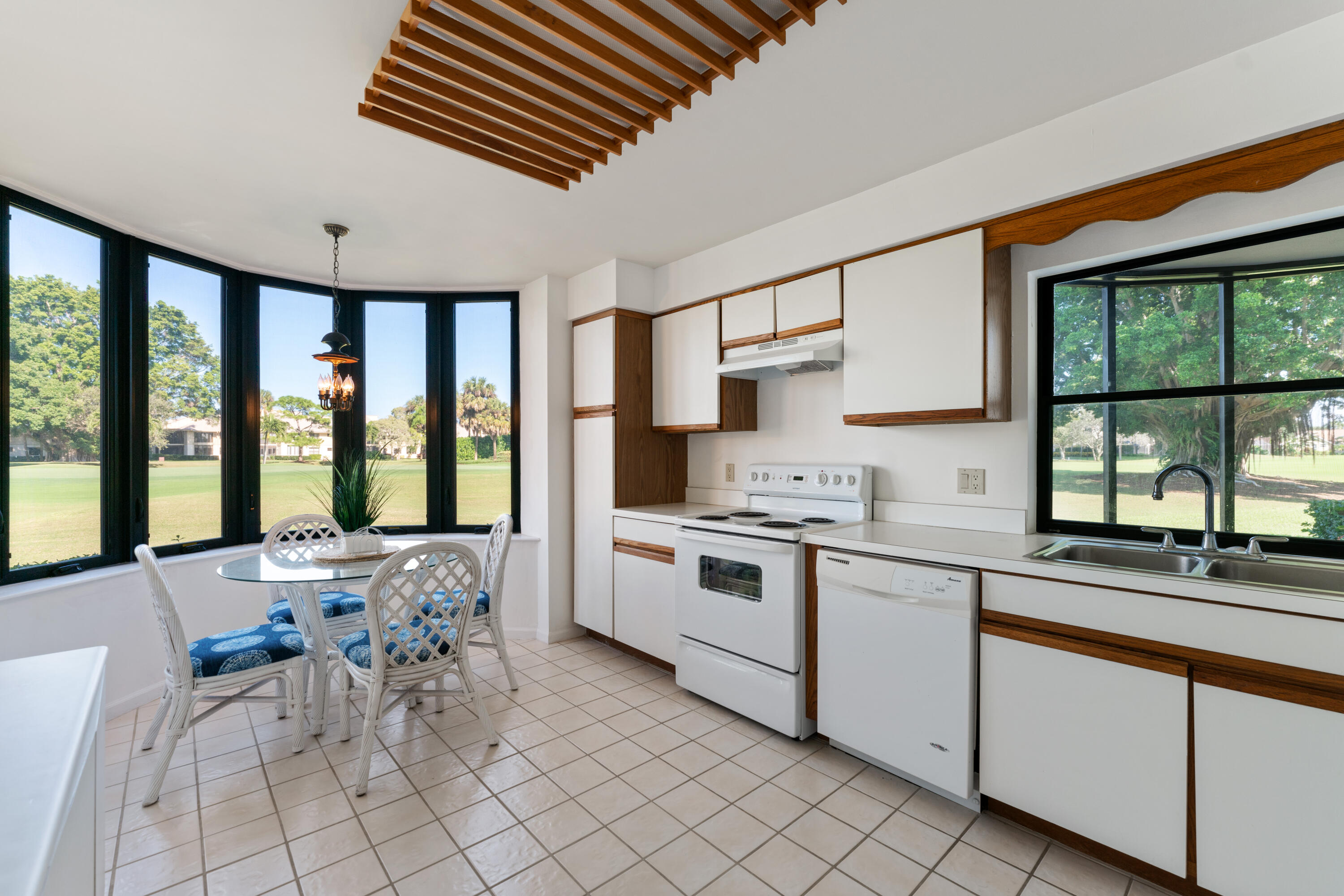 16970 Waterbend Drive, Unit 146 Jupiter, FL 33477 - Photo 11 of 30 a kitchen with a stove a sink and cabinets
