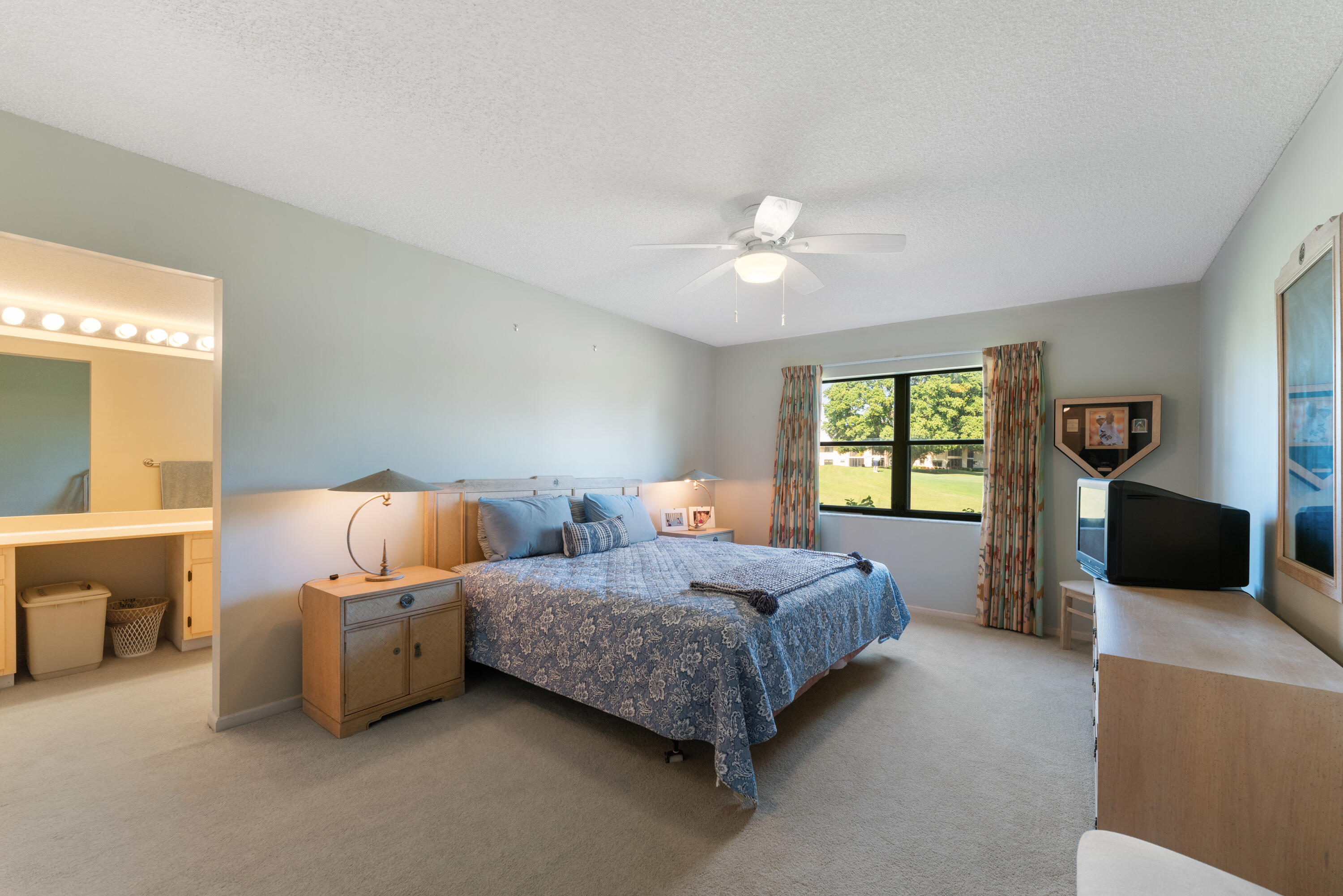 16970 Waterbend Drive, Unit 146 Jupiter, FL 33477 - Photo 17 of 30 a bedroom with a bed a couch and a window