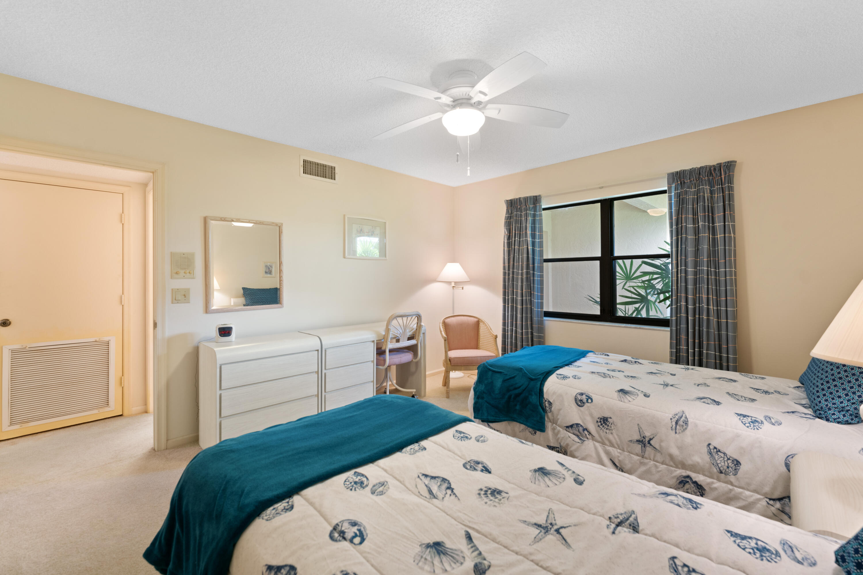 16970 Waterbend Drive, Unit 146 Jupiter, FL 33477 - Photo 24 of 30 a bedroom with two beds and a window