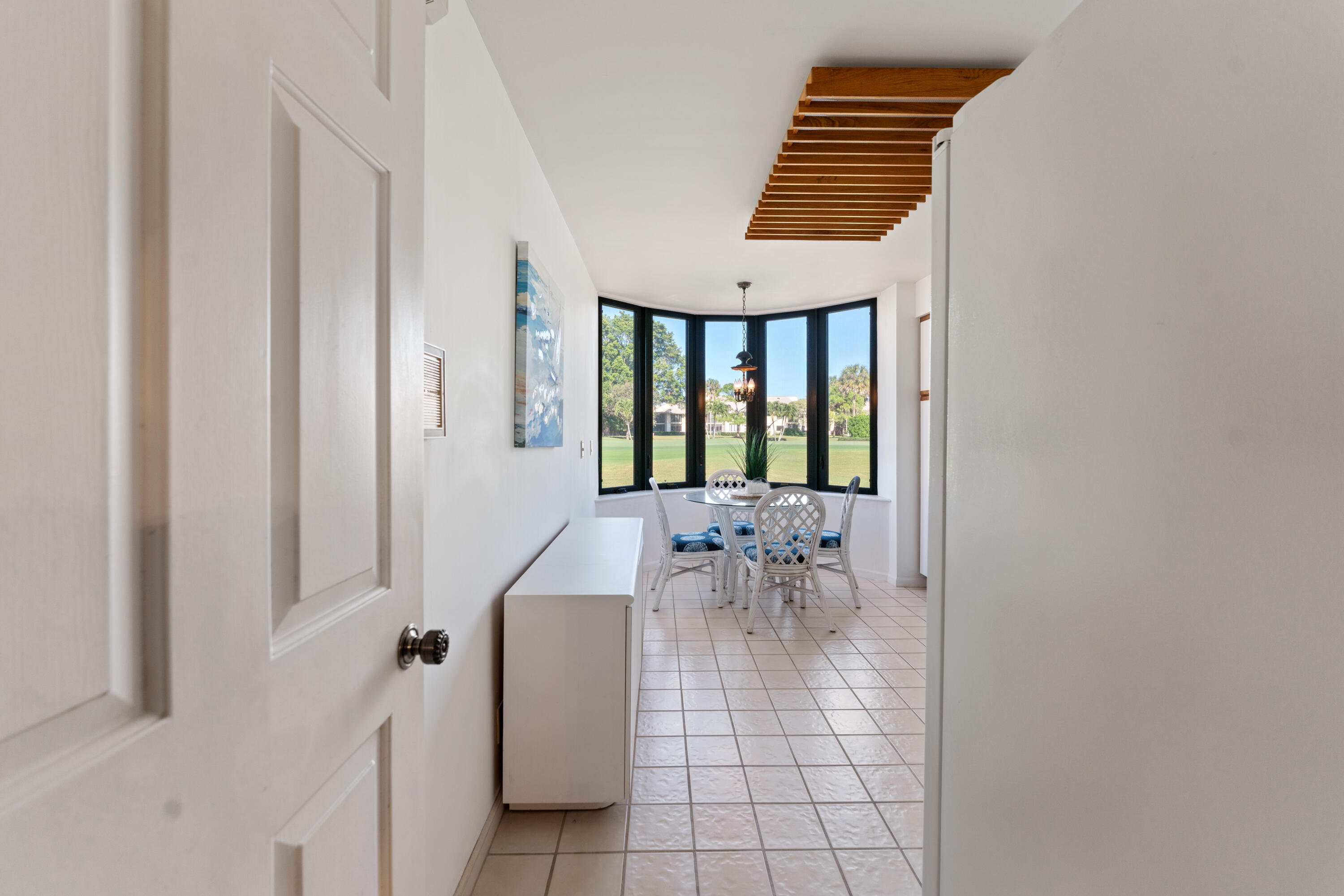 16970 Waterbend Drive, Unit 146 Jupiter, FL 33477 - Photo 10 of 30 a view of entryway and hall with a window