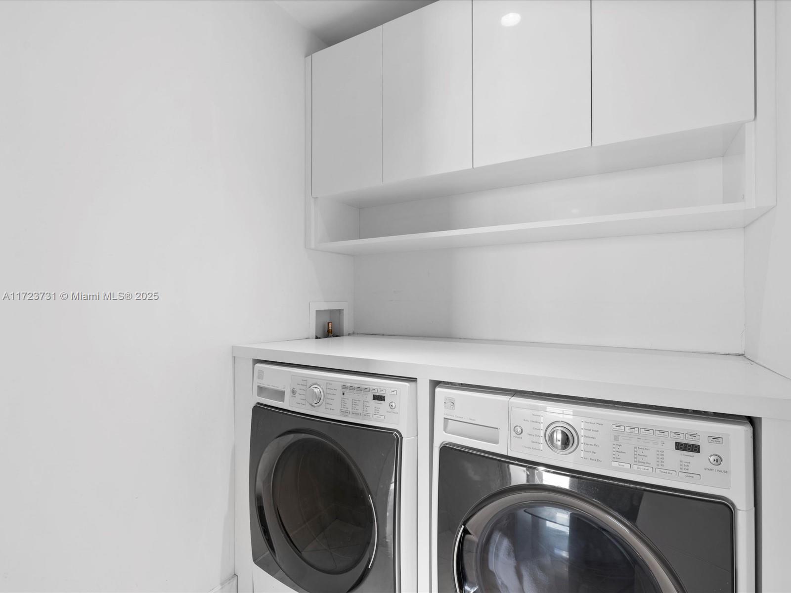 1425 Brickell Avenue, Unit 52BC Miami, FL 33131 - Photo 49 of 72 a close up view of washer and dryer