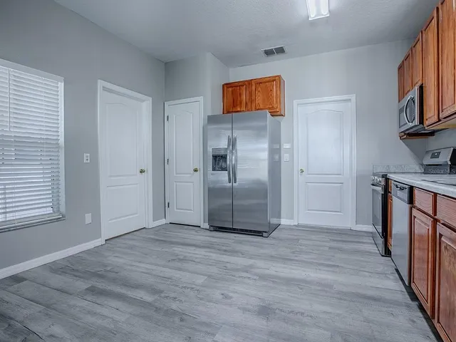 a view of a kitchen from the hallway