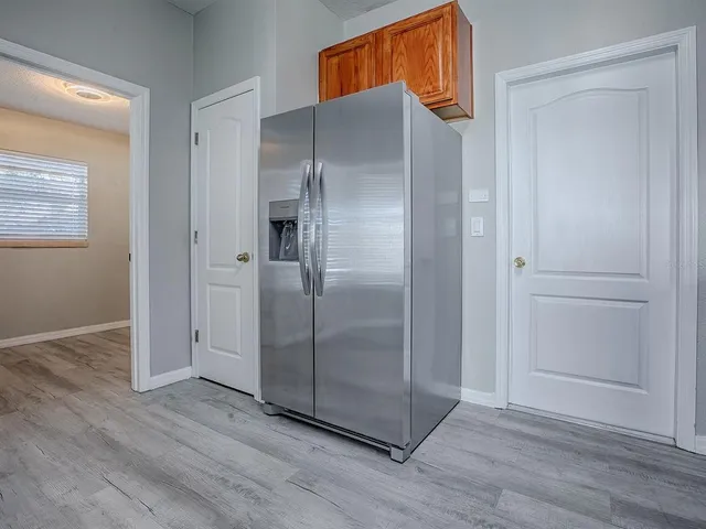 a bathroom with a shower and a sink