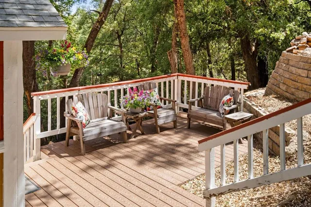 a view of a two chairs in the balcony