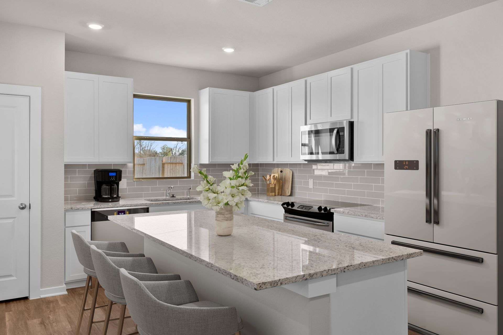 13319 Prado Rdg Lane Rosharon, TX 77583 - Photo 2 of 33 a kitchen with appliances a sink cabinets and a counter top space