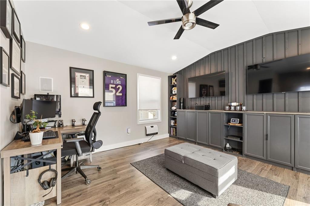 221 Laurel Avenue Southwest Atlanta, GA 30314 - Photo 11 of 29 a living room with furniture a flat screen tv and kitchen view