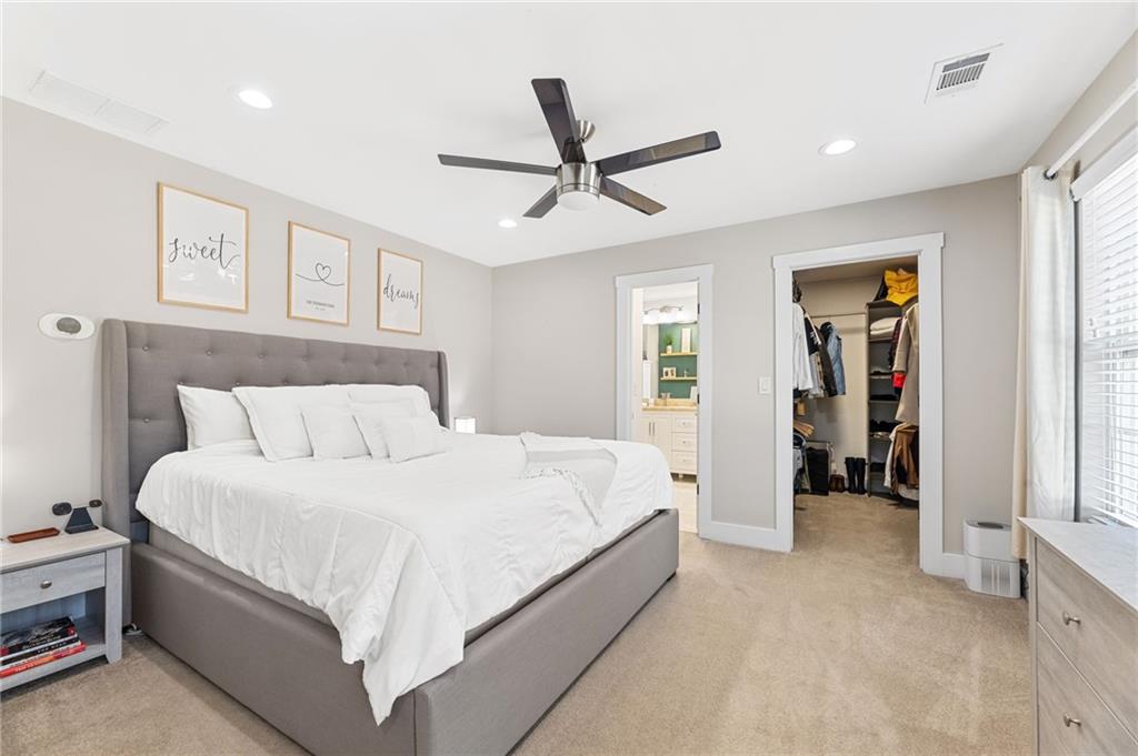 221 Laurel Avenue Southwest Atlanta, GA 30314 - Photo 22 of 29 a spacious bedroom with a bed and a walk in closet