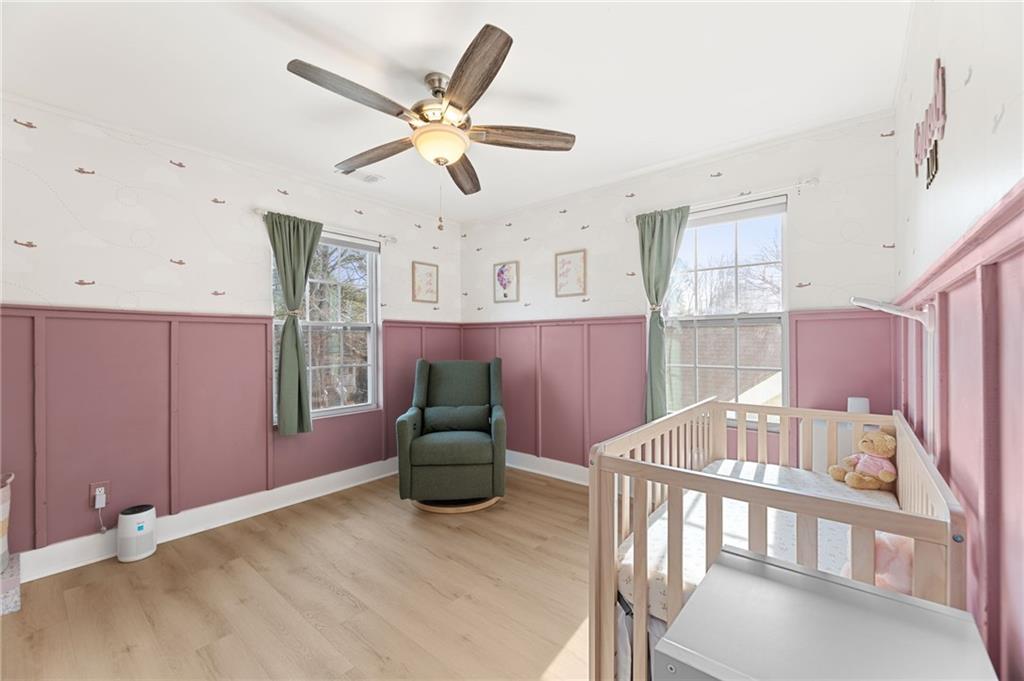 221 Laurel Avenue Southwest Atlanta, GA 30314 - Photo 5 of 29 a bedroom with furniture and wooden floor