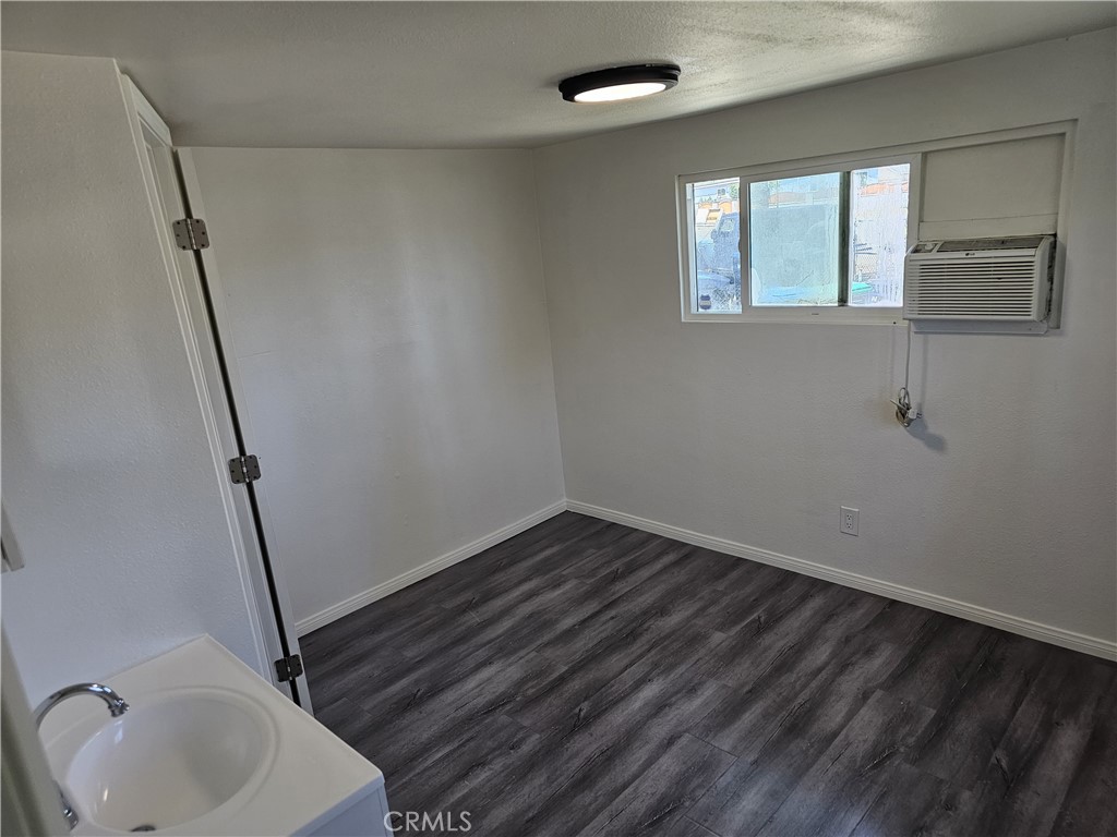 22775 Raymond Road Perris, CA 92570 - Photo 14 of 23 a bathroom with a sink and a mirror