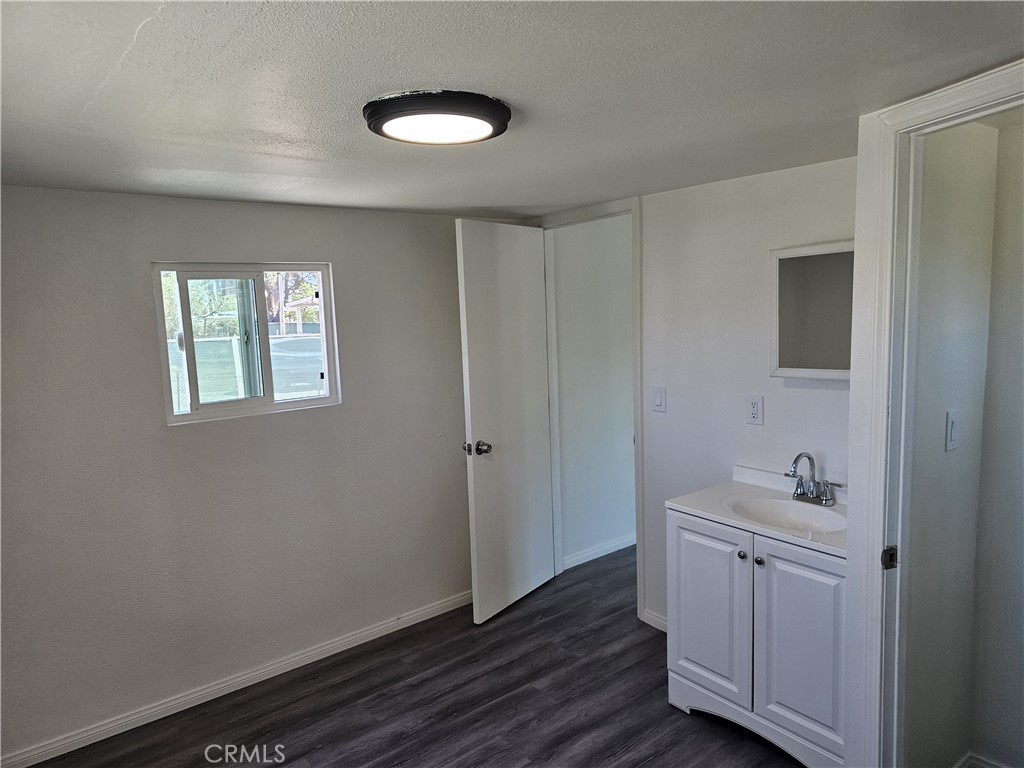 22775 Raymond Road Perris, CA 92570 - Photo 16 of 23 a bathroom with a sink and a mirror