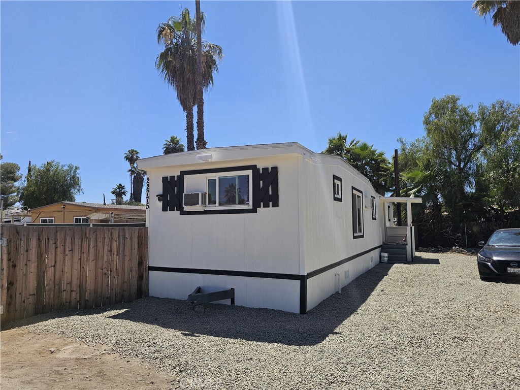 22775 Raymond Road Perris, CA 92570 - Photo 8 of 23 a front view of a house with a yard