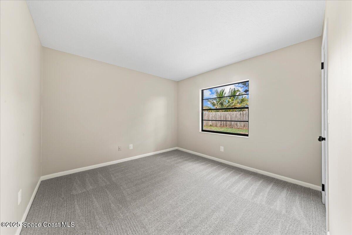 2010 Talloak Road Melbourne, FL 32935 - Photo 14 of 45 an empty room with windows