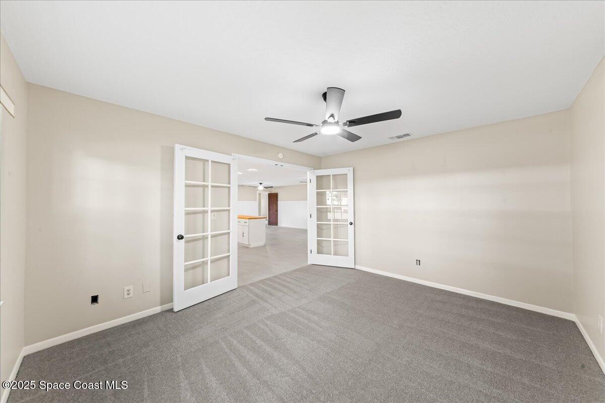 2010 Talloak Road Melbourne, FL 32935 - Photo 15 of 45 a view of an empty room with a window
