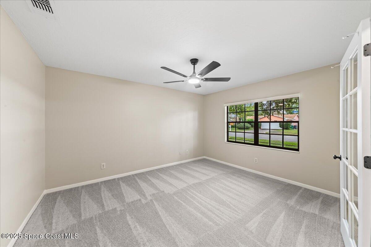 2010 Talloak Road Melbourne, FL 32935 - Photo 16 of 45 a view of an empty room with a window