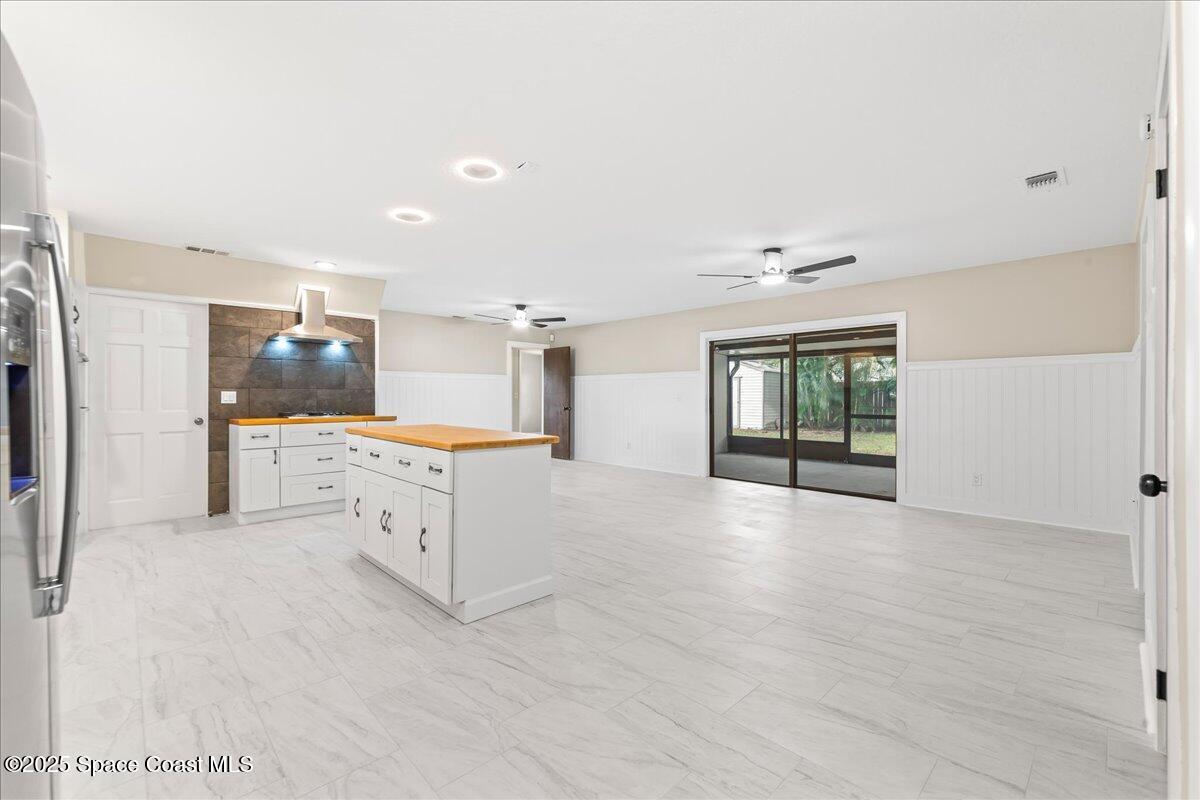 2010 Talloak Road Melbourne, FL 32935 - Photo 2 of 45 a view of a kitchen with refrigerator and a sink