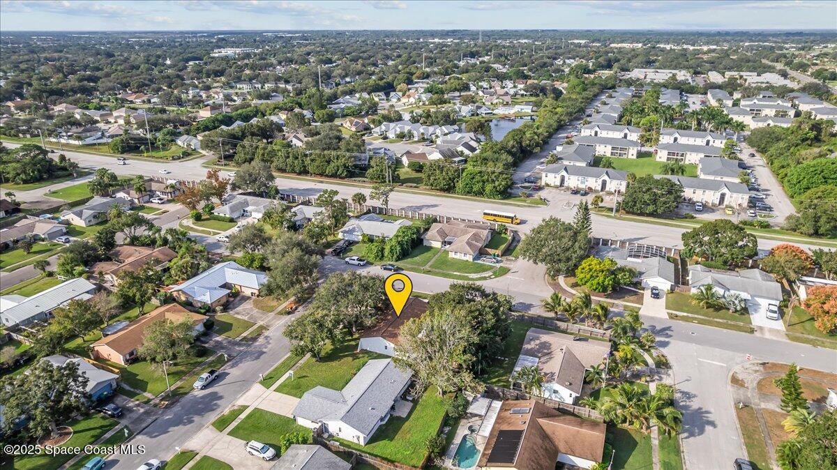 2010 Talloak Road Melbourne, FL 32935 - Photo 22 of 45 an aerial view of residential houses with outdoor space
