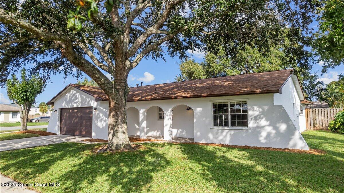 2010 Talloak Road Melbourne, FL 32935 - Photo 23 of 45 a view of a house with a backyard