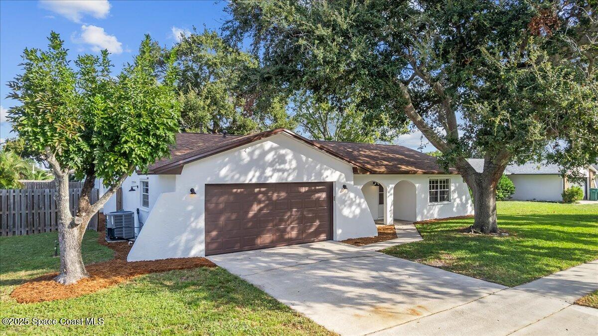 2010 Talloak Road Melbourne, FL 32935 - Photo 24 of 45 a front view of a house with a yard