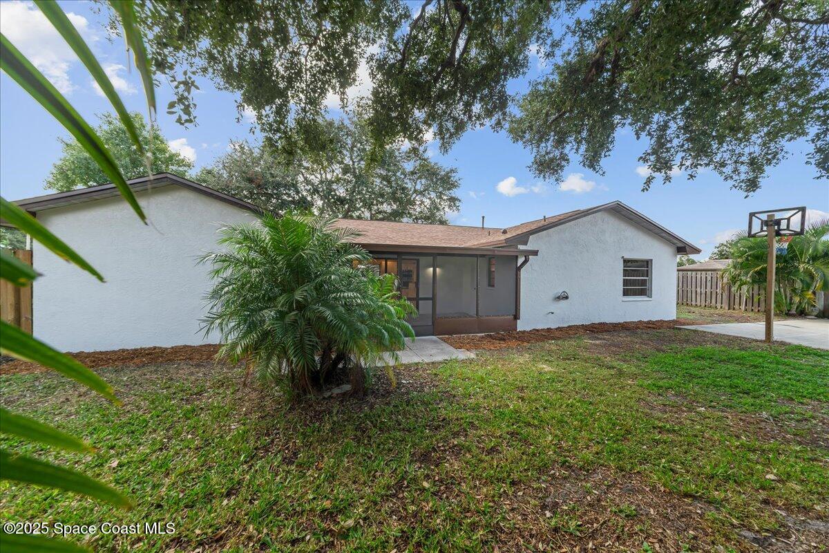2010 Talloak Road Melbourne, FL 32935 - Photo 25 of 45 a house with lots of trees