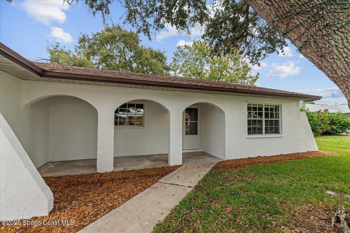 2010 Talloak Road Melbourne, FL 32935 - Photo 31 of 45 a front view of a house with a yard