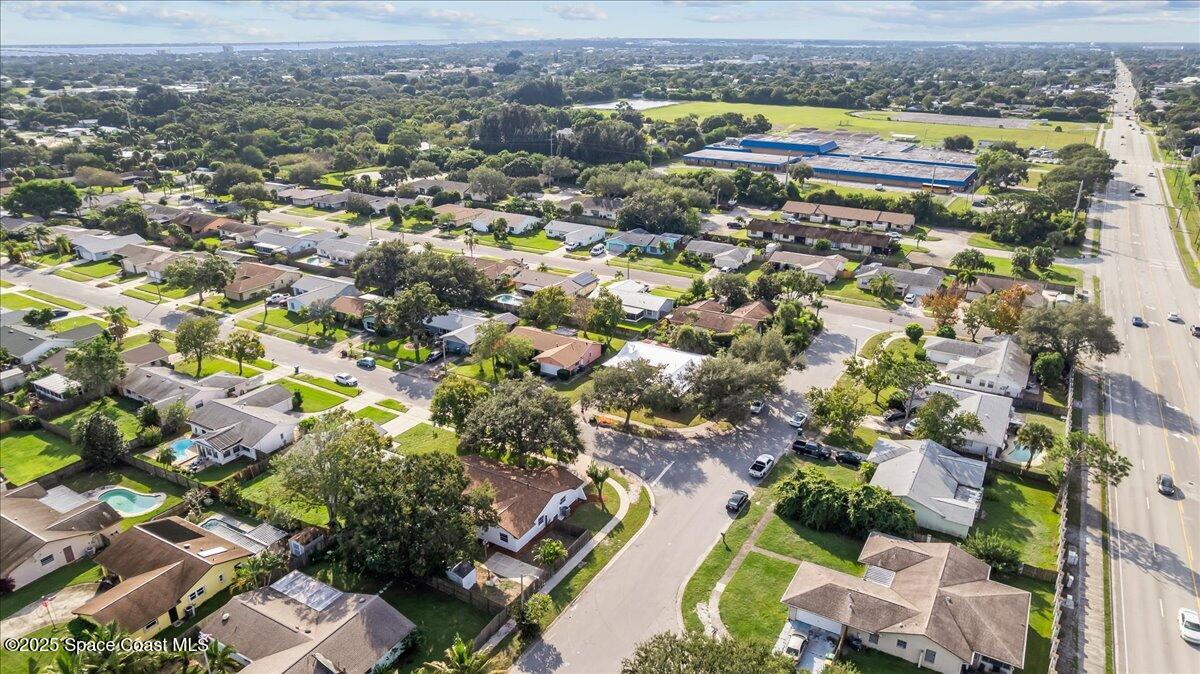 2010 Talloak Road Melbourne, FL 32935 - Photo 39 of 45 an aerial view of residential houses with outdoor space
