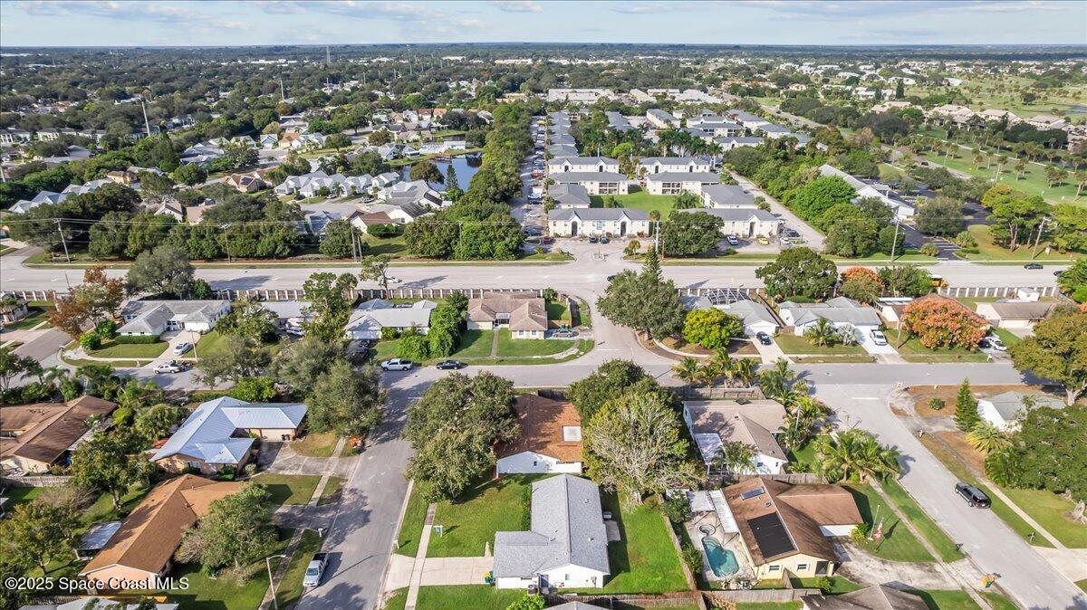2010 Talloak Road Melbourne, FL 32935 - Photo 42 of 45 an aerial view of residential houses with outdoor space