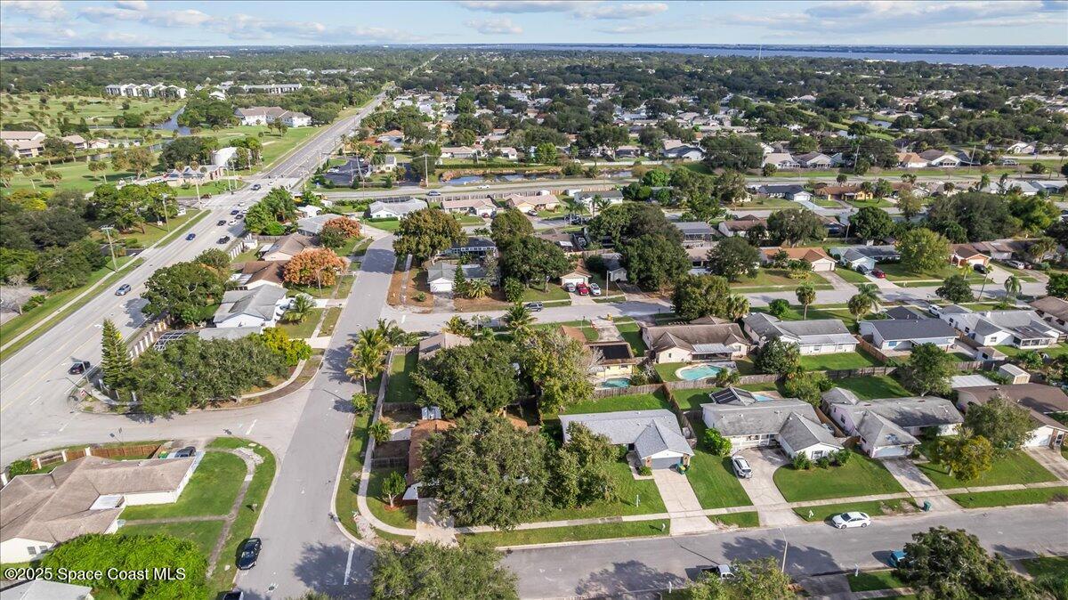 2010 Talloak Road Melbourne, FL 32935 - Photo 44 of 45 an aerial view of residential houses with outdoor space