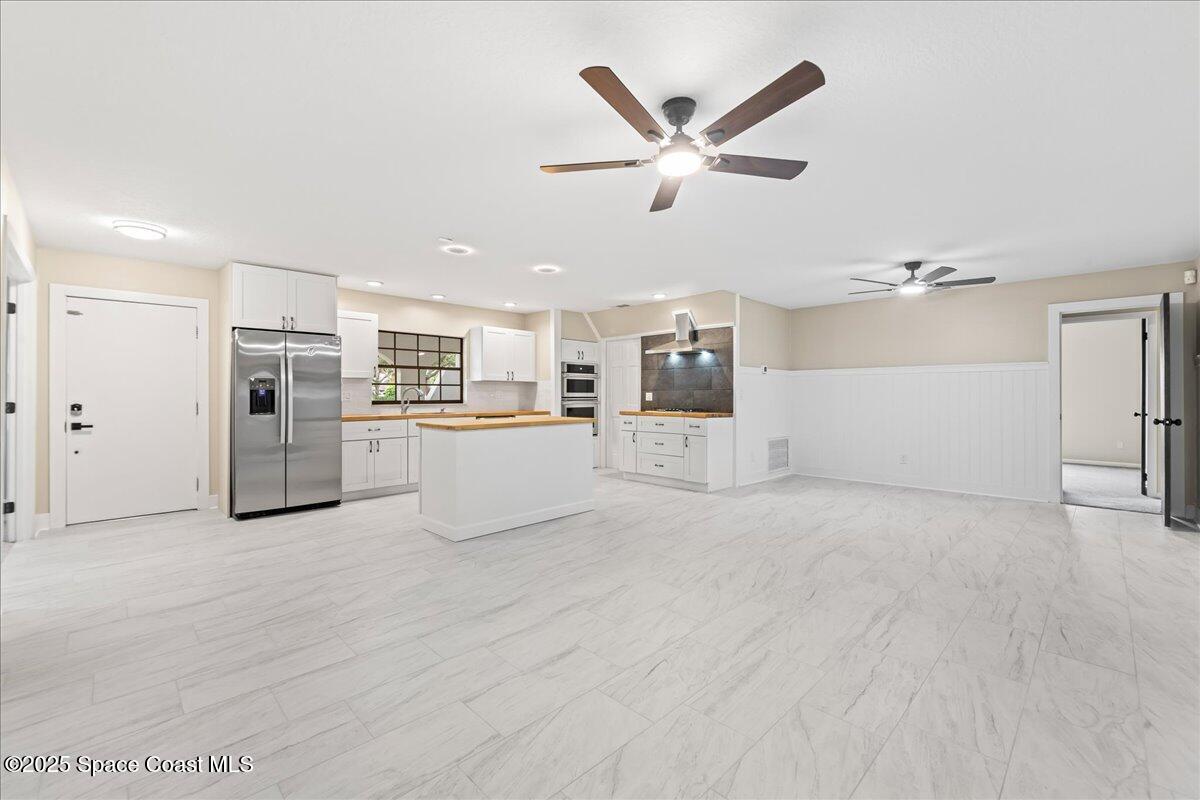 2010 Talloak Road Melbourne, FL 32935 - Photo 6 of 45 a view of a electric appliances in kitchen and empty room
