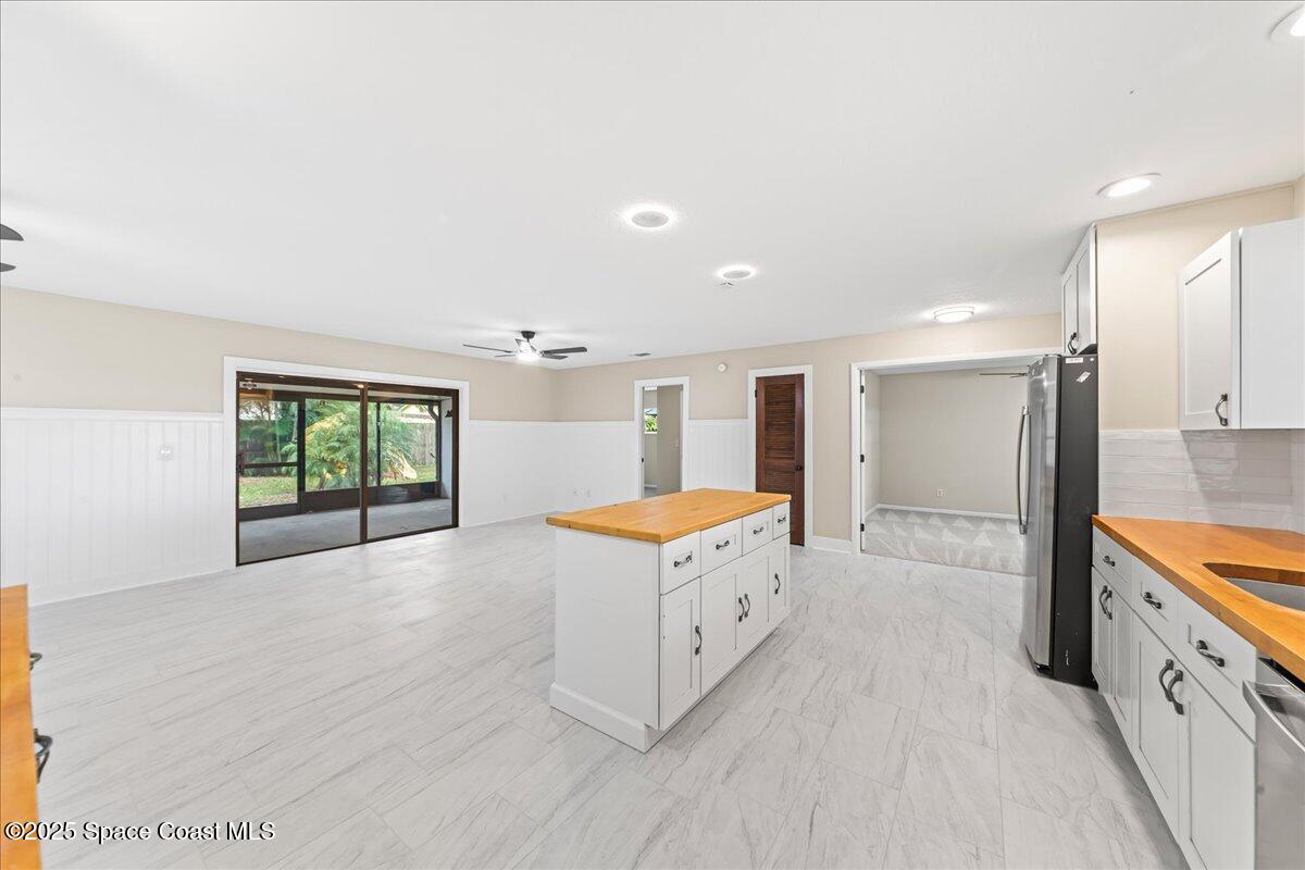 2010 Talloak Road Melbourne, FL 32935 - Photo 8 of 45 a kitchen with stainless steel appliances granite countertop a stove and a sink