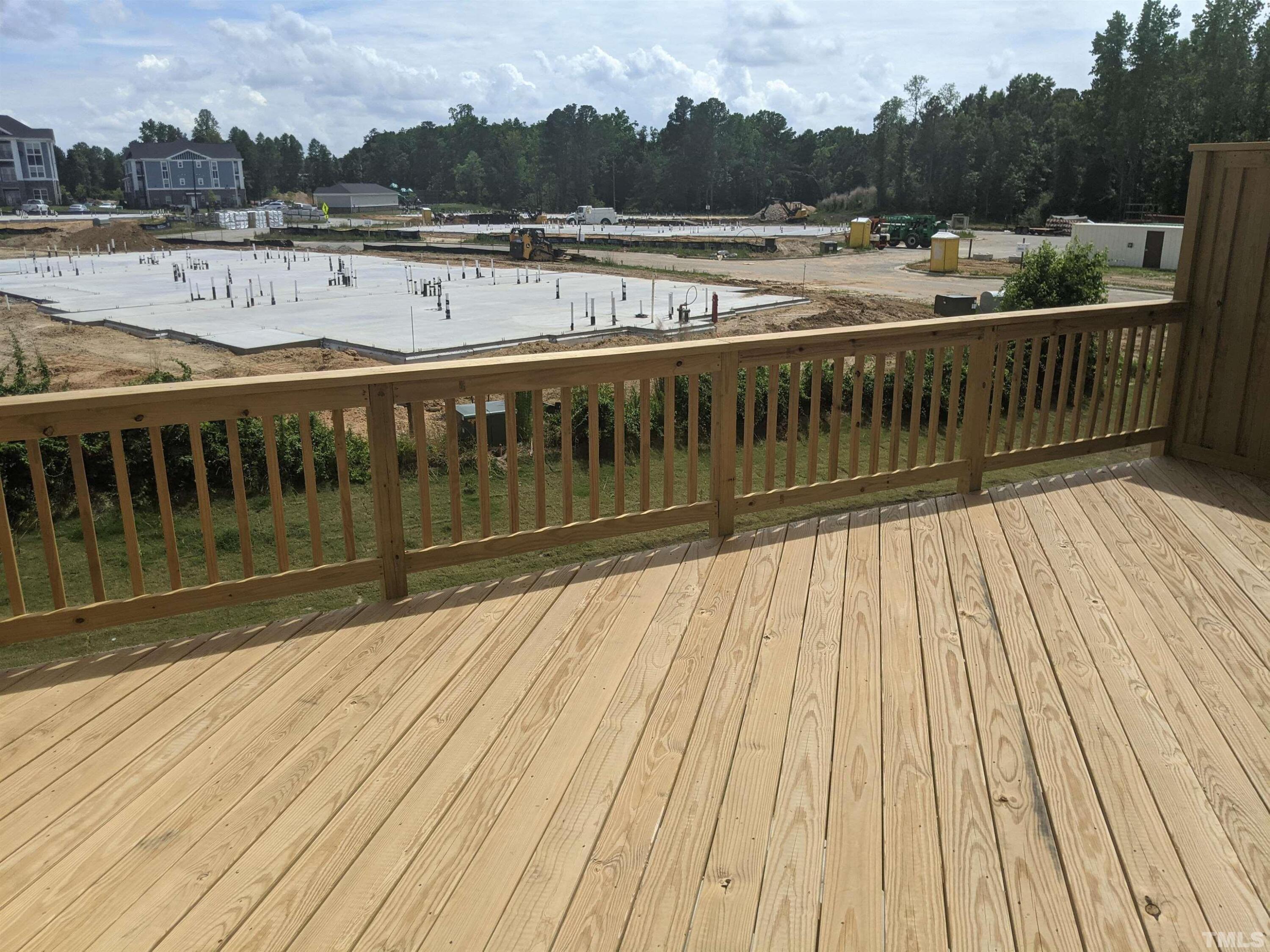 912 Robbie Jackson Lane Fuquay-Varina, NC 27526 - Photo 7 of 10 a view of a balcony with wooden floor and lake view