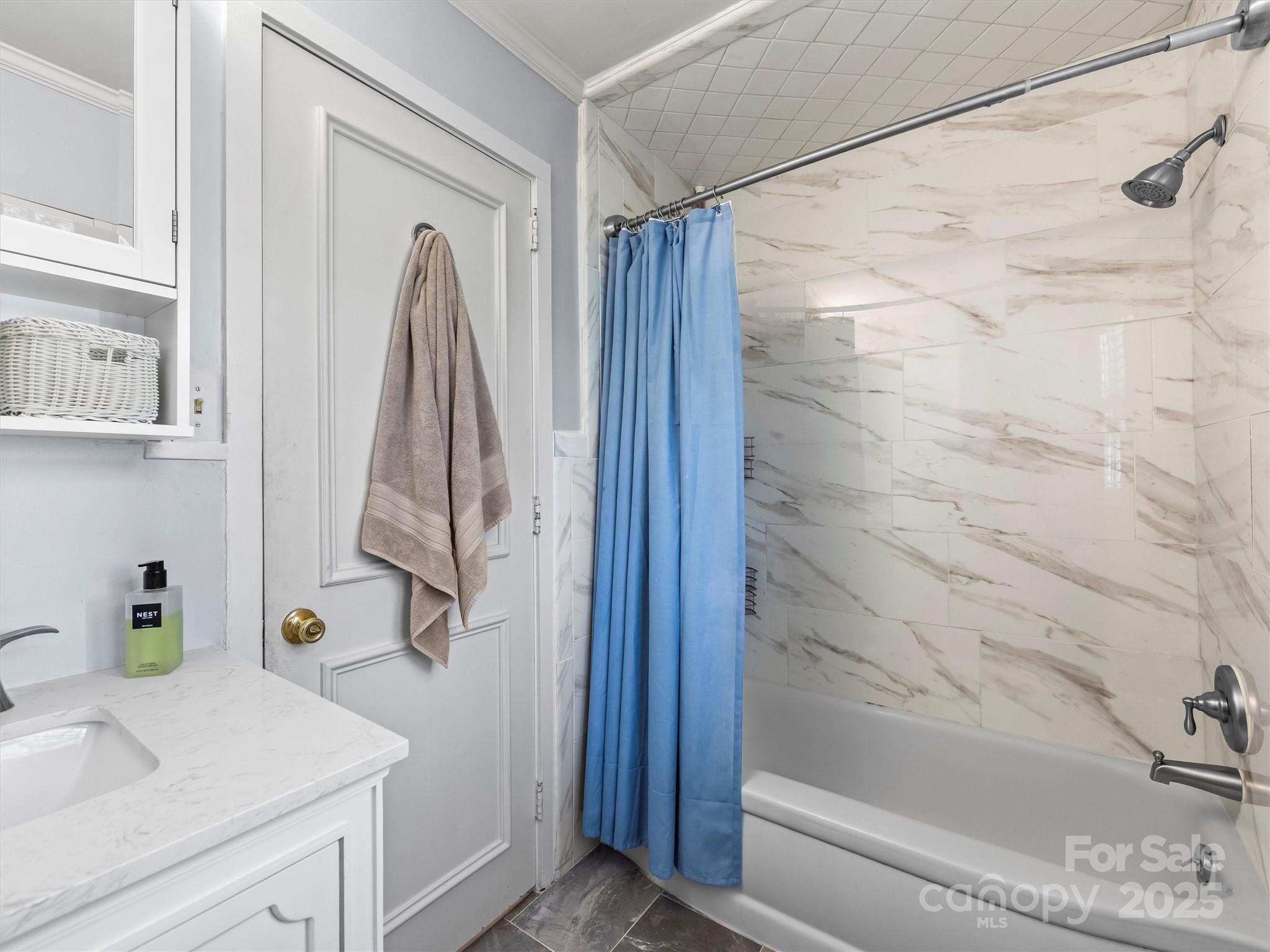 9 Hilltop Road Asheville, NC 28803 - Photo 15 of 34 a bathroom with a shower and a sink