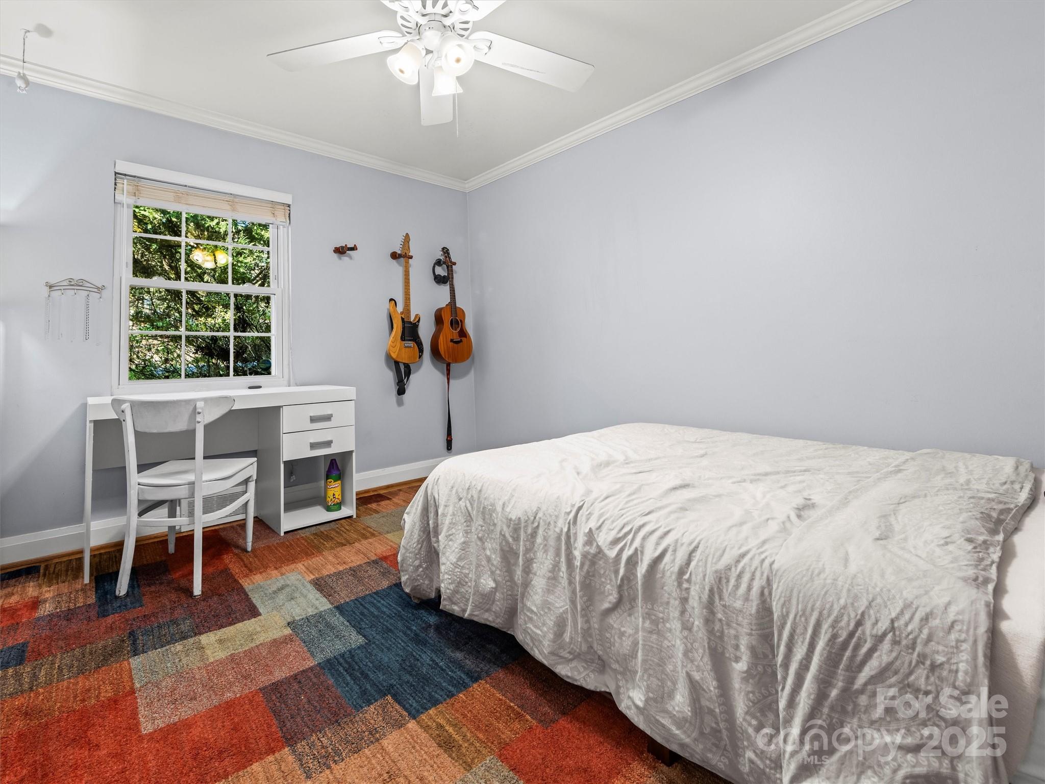 9 Hilltop Road Asheville, NC 28803 - Photo 16 of 34 a bed room with a bed and a chair